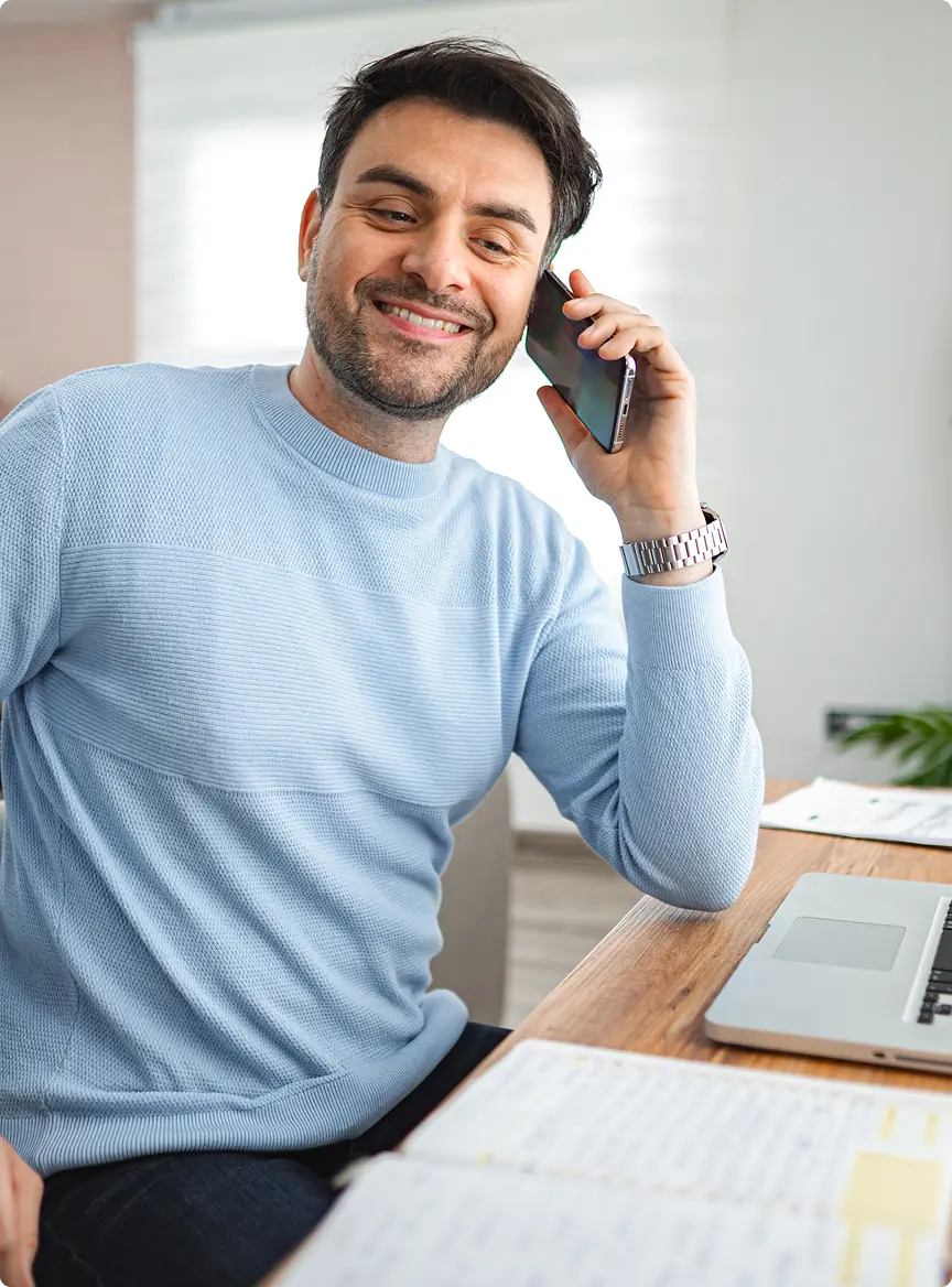anyconv.com man sitting at desk talking on cell phone 2025 01 08 04 26 36 utc